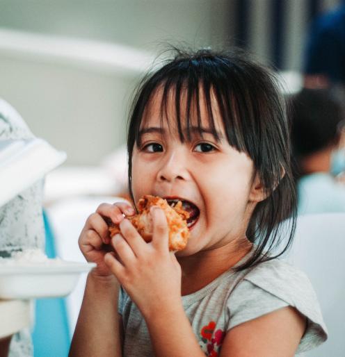 Schoolgirl eating lunch